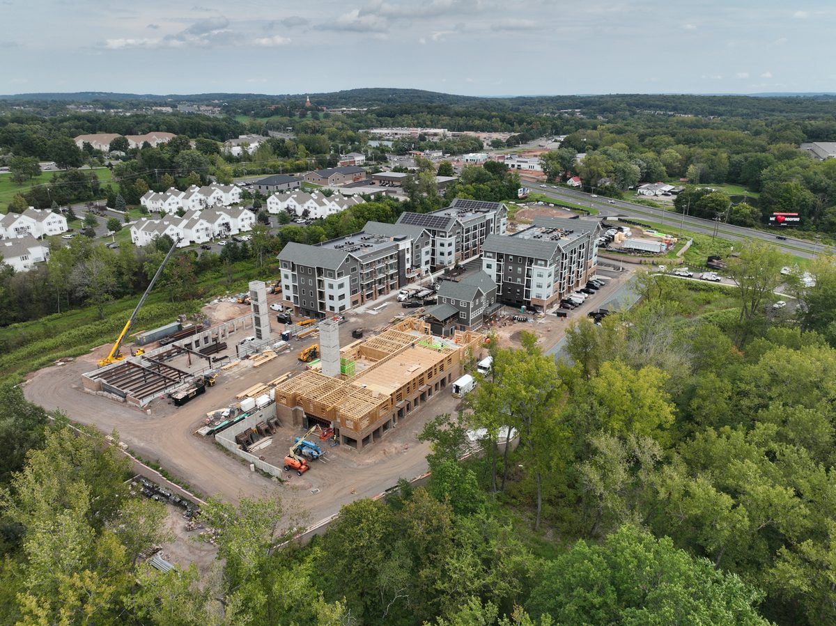 East elevation of a multifamily construction site early in the framing phase