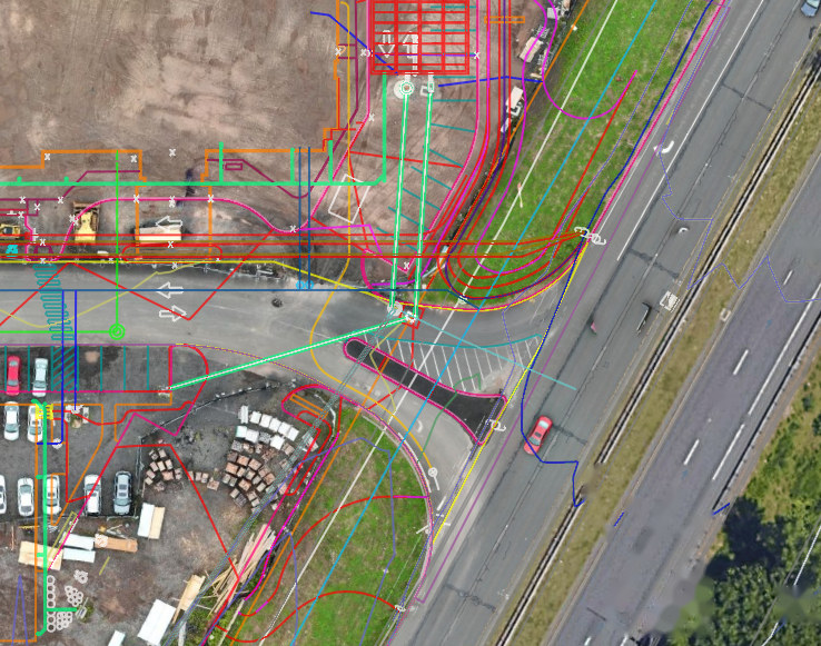 Orthomosaic of a site frontage with right-of-way lines, drainage, and utility runs resolved against the adjacent state highway